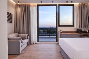 A bed or beds in a room at NLH KERAMEIKOS - Neighborhood Lifestyle Hotels