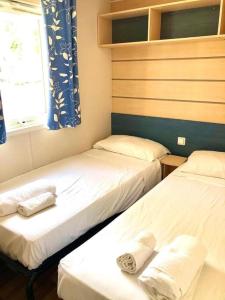 Posteľ alebo postele v izbe v ubytovaní Camping Village Nice Garden