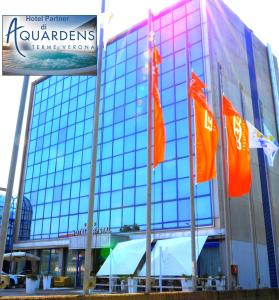 a building with flags in front of it at Hotel Krystal in Bussolengo