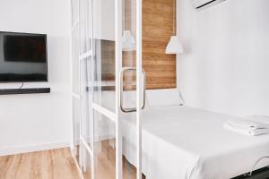 Ένα ή περισσότερα κρεβάτια σε δωμάτιο στο EDIFICIO SAN FELIX
