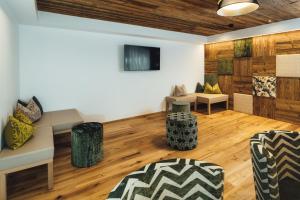 A television and/or entertainment centre at Schneeweiss lifestyle - Apartments - Living