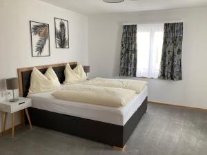Postel nebo postele na pokoji v ubytování Apartementhaus Schöndorfer