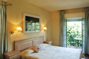 Postel nebo postele na pokoji v ubytování Hotel Mignon