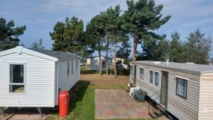 two mobile homes parked next to each other at Seton Sands Haven Holiday Village in Edinburgh