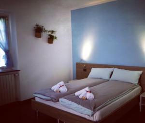 Postel nebo postele na pokoji v ubytování Al Chiar di Luna B&B Valtellina