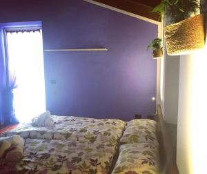 Postel nebo postele na pokoji v ubytování Al Chiar di Luna B&B Valtellina