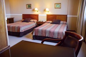 Katil atau katil-katil dalam bilik di Premier Hill Suites Hotel