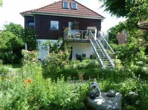 a house with a garden in front of it at Rieger FW 2 in Eckernförde