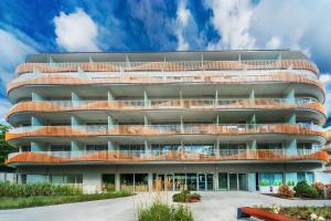 an office building with a circular facade at ApartPark Baltic Home in Świnoujście