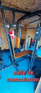 a gym with a sale ofmission sign in a room at insolite bus anglais le Buckinghambus in Saint-Philbert-sur-Risle