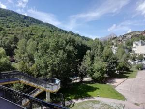a view from the balcony of a resort with trees at Le cocon du prorel in Briançon