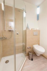 a bathroom with a shower and a toilet at ancora Marina Haus 1 Nr 09, Typ 3 in Neustadt in Holstein
