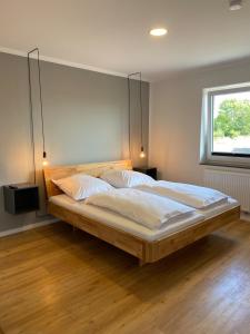 Postel nebo postele na pokoji v ubytování Ferienhaus Westwind FH5