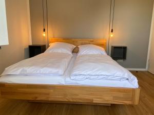 Postel nebo postele na pokoji v ubytování Ferienhaus Westwind FH5