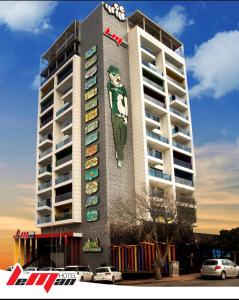 a tall building with a painting on the side of it at Leman Otel in Denizli
