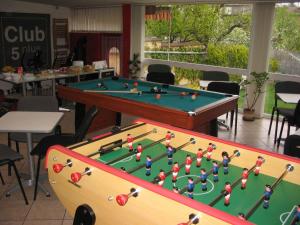 a pool table with balls on it in a room at Bed & Breakfast Penzion Brno in Brno