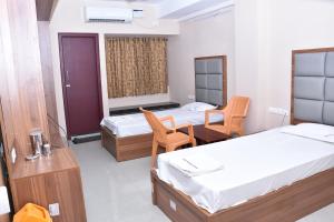 Voodi või voodid majutusasutuse Hotel Vijay Krishna toas