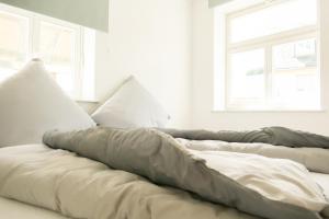 Ένα ή περισσότερα κρεβάτια σε δωμάτιο στο Ferienwohnung Neu "Zum Westerwald" LAHN01