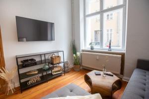 a living room with a couch and a table at Apartment No1 in Stralsund