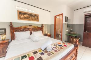 Postel nebo postele na pokoji v ubytování Pondok Taksu Bali