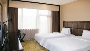 Postel nebo postele na pokoji v ubytování Holiday Inn Mudanjiang by IHG