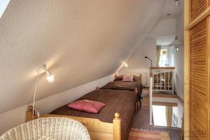 a bedroom with two beds in a room at Haus Seeschwalbe, FW 6 in Zingst