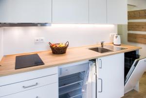 Kuchyň nebo kuchyňský kout v ubytování Apartmány Tina a Zdenka - Stožec