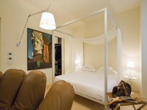 Postel nebo postele na pokoji v ubytování Petronilla - Hotel In Bergamo