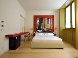 Postel nebo postele na pokoji v ubytování Petronilla - Hotel In Bergamo