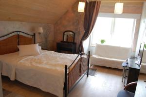 Postel nebo postele na pokoji v ubytování Altmõisa Guesthouse