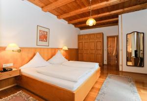 Postel nebo postele na pokoji v ubytování Stoll's Hotel Alpina