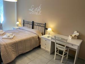 Postel nebo postele na pokoji v ubytování BELLA ASSISI B & B
