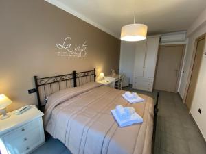 Postel nebo postele na pokoji v ubytování BELLA ASSISI B & B