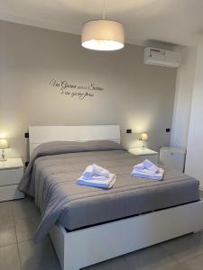 Postel nebo postele na pokoji v ubytování BELLA ASSISI B & B
