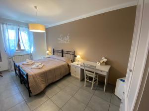 Postel nebo postele na pokoji v ubytování BELLA ASSISI B & B