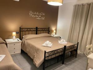 Postel nebo postele na pokoji v ubytování BELLA ASSISI B & B
