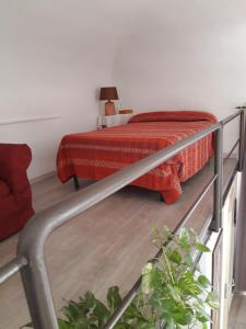 A bed or beds in a room at Maqueda Apartments