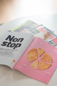a magazine with a picture of a pie on the cover at Apartments Westfield Arkadia Burakowska by Renters in Warsaw