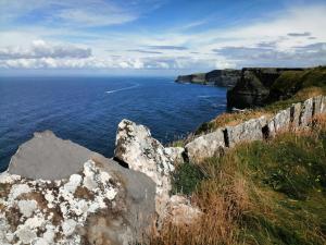 a view of the ocean from a cliff at Puffin rooms in Lisdoonvarna
