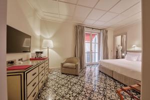 Postel nebo postele na pokoji v ubytování Hotel Cappuccino - Palma