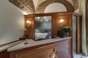 Postel nebo postele na pokoji v ubytování Hotel Borromeo
