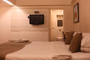 Postel nebo postele na pokoji v ubytování Hotel Samraj