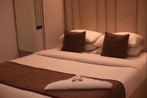 Postel nebo postele na pokoji v ubytování Hotel Samraj