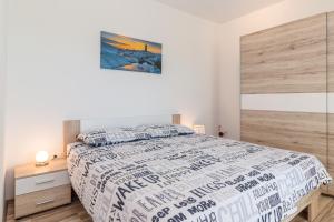 a bedroom with a large bed with a wooden headboard at Villa Green Holiday in Barban +29 photos