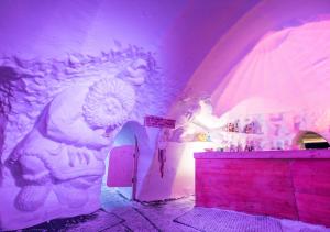 a room with a wall with a painting of a lion at Village Igloo Val Thorens in Val Thorens