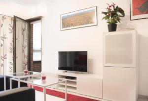 Telewizja i/lub zestaw kina domowego w obiekcie Gran Confort Muelle Uno