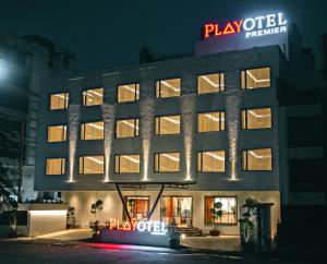 a hotel building with a sign that reads playfield premier at Playotel Premier Vijay Nagar in Indore