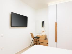 TV a/nebo společenská místnost v ubytování ROOF GARDEN SUITE