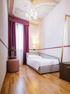 Postel nebo postele na pokoji v ubytování Hotel Do Pozzi