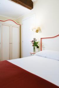 Postel nebo postele na pokoji v ubytování Hotel Do Pozzi